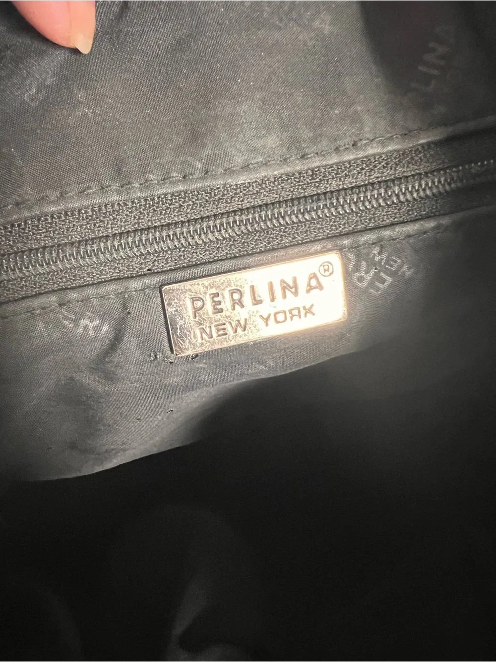 Perlina Black Leather Drawstring Flap Backpack